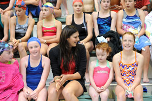 stephanie sits with kate daly and other swim clinic kids photo delly carr sal.jpg